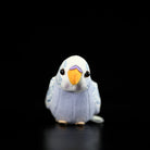 Front view of a violet budgerigar plush toy, showcasing its adorable face and vivid colors