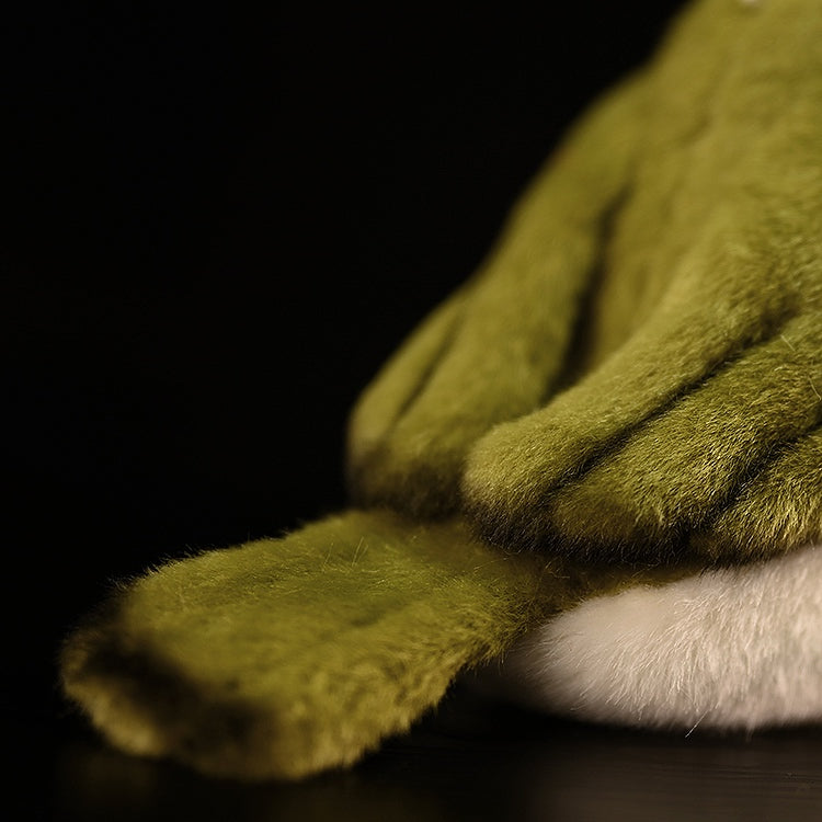 Close-up of the Warbling White-Eye plush toy’s tail, emphasizing its soft and realistic design