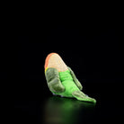 Back view of a Lilian's lovebird plush toy, highlighting its detailed green tail and lifelike design