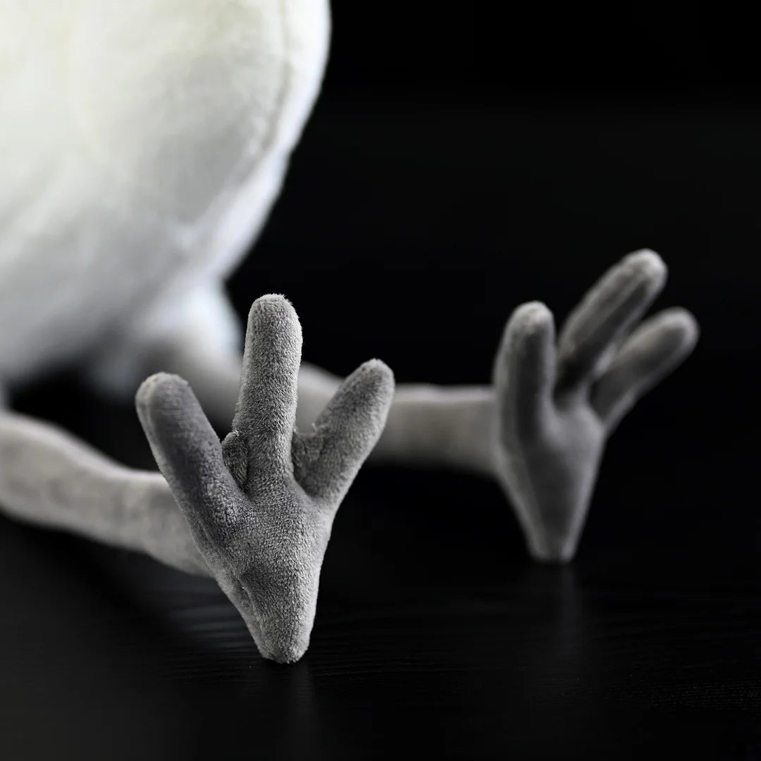Detailed view of the Great White Egret plush toy's soft gray feet, adding to its lifelike design