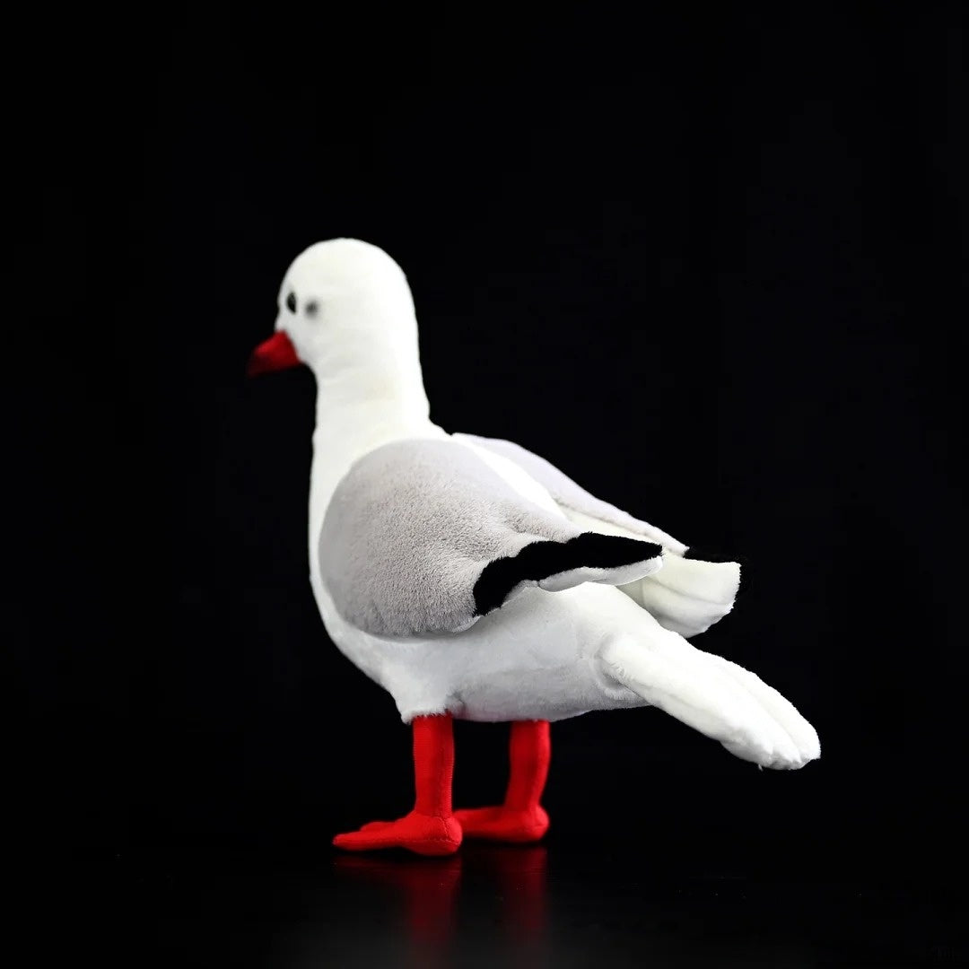 Back angle of a lifelike Black-headed Gull plush, showcasing detailed tail feathers and vibrant red legs