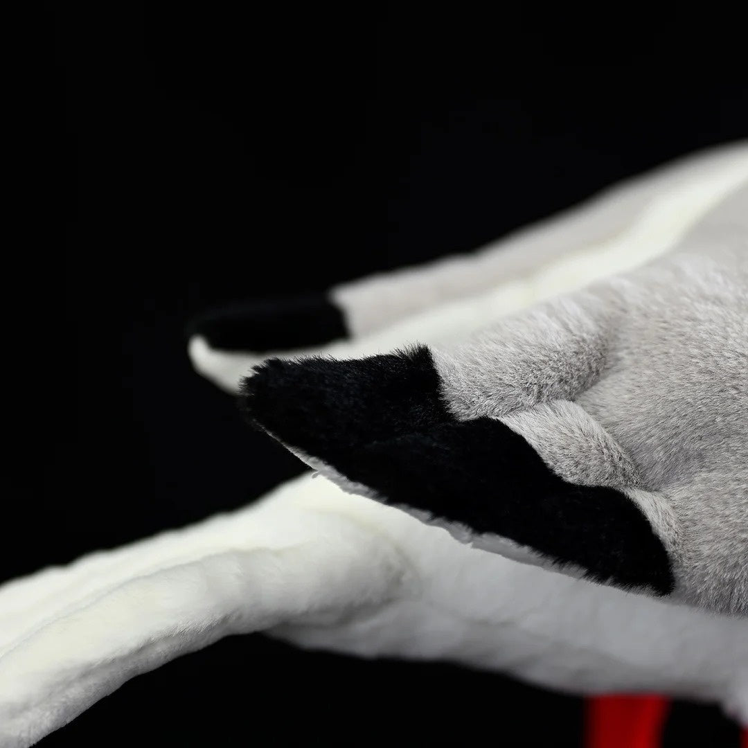 Close-up of the Black-headed Gull plush's black-tipped gray wings, showcasing its fine craftsmanship