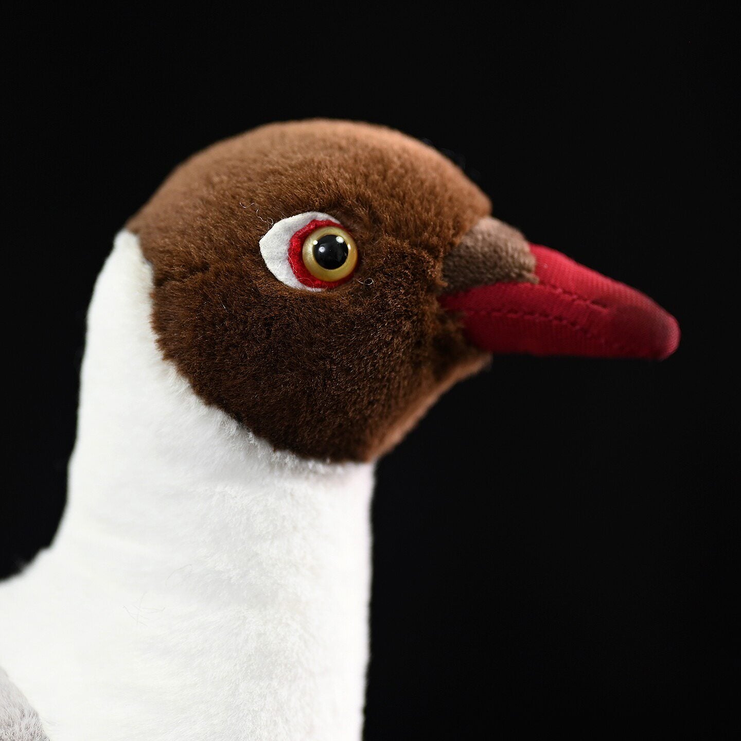 Close-up of the head of a Brown-headed Gull plush by SoftDaysLab, showing intricate craftsmanship and details