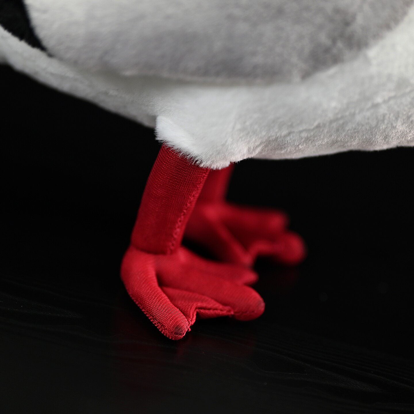 Close-up of the vivid red feet of a Brown-headed Gull plush by SoftDaysLab, made with attention to detail
