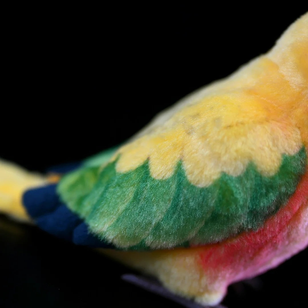 Wing details of the Sun Conure plush toy by SoftDaysLab®, highlighting its vivid green and yellow feathers