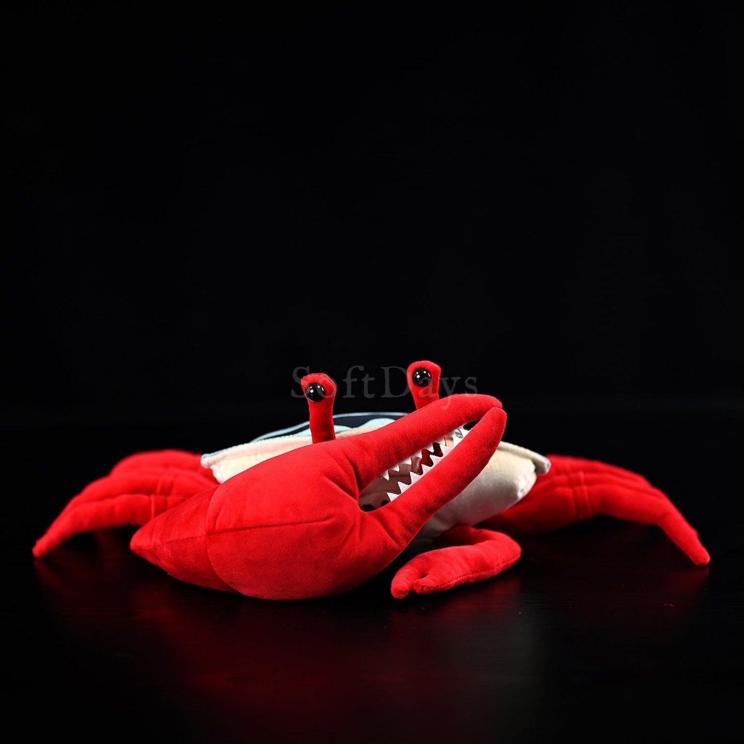 Front view of cute fiddler crab plush toy with large red claw and bright shell, designed by SoftDaysLab