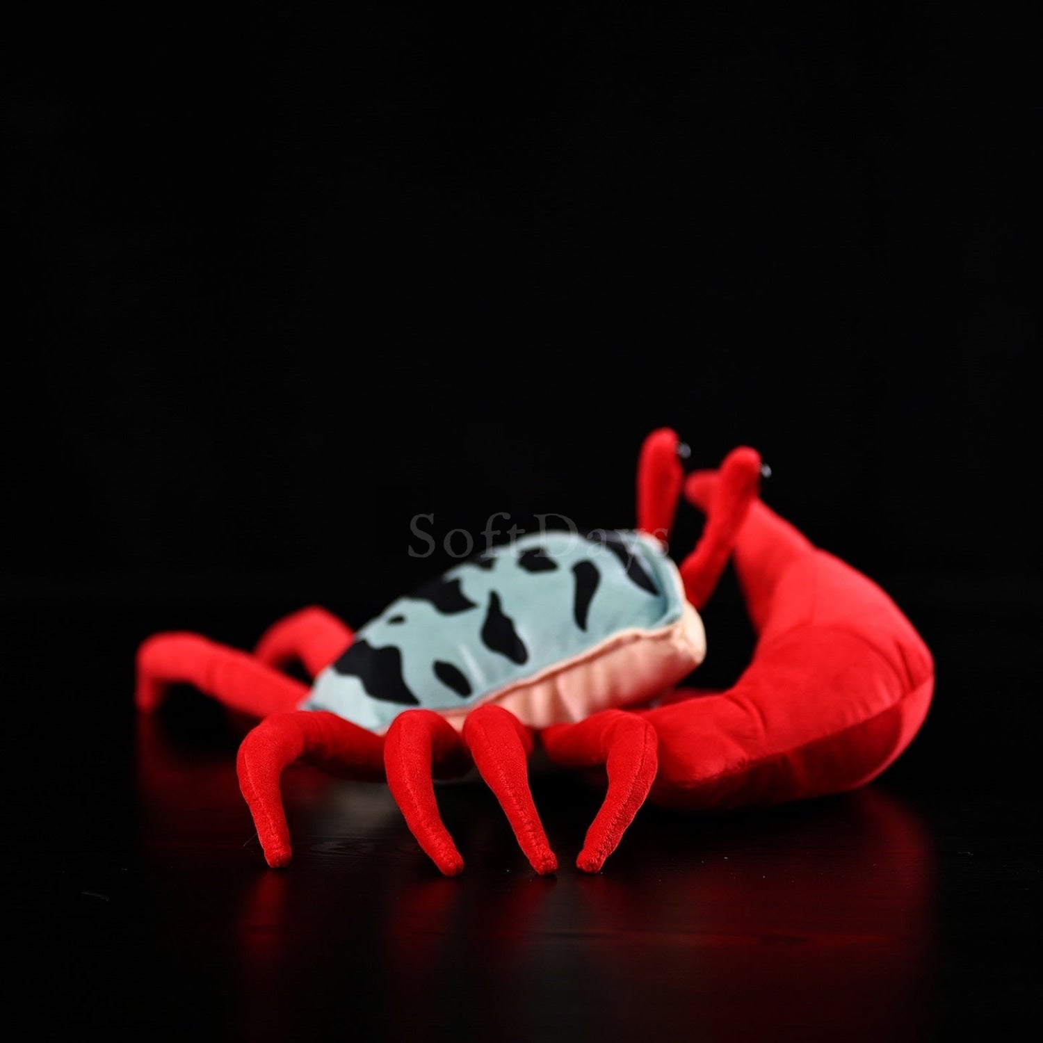 Detailed side view of fiddler crab stuffed toy with soft fabric and vibrant colors for ocean-themed decor