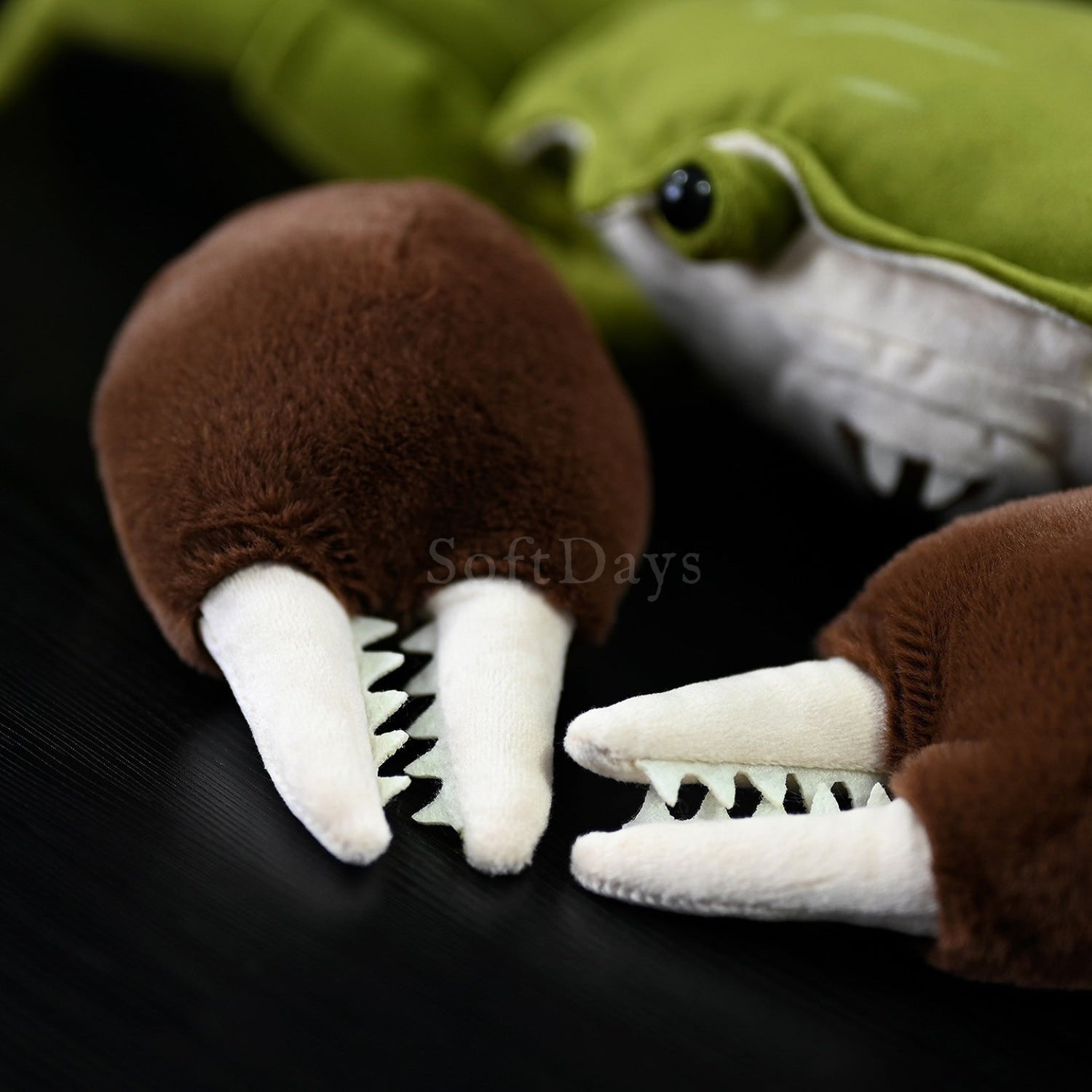 Close-up of the plush toy's furry claws, showcasing the lifelike textures of the Chinese mitten crab