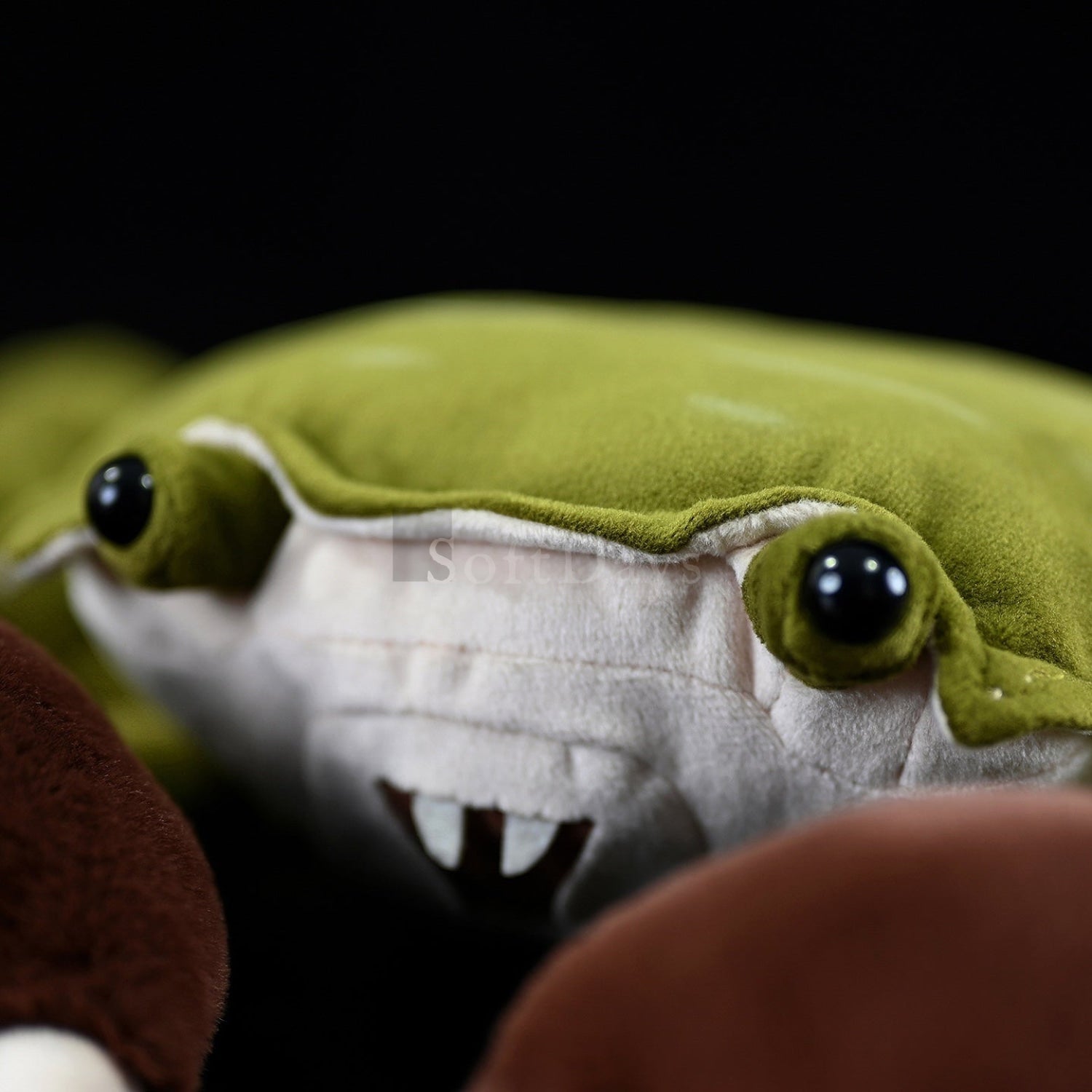 Close-up of the Chinese mitten crab plush toy's face, featuring vibrant details and soft, lifelike fabric