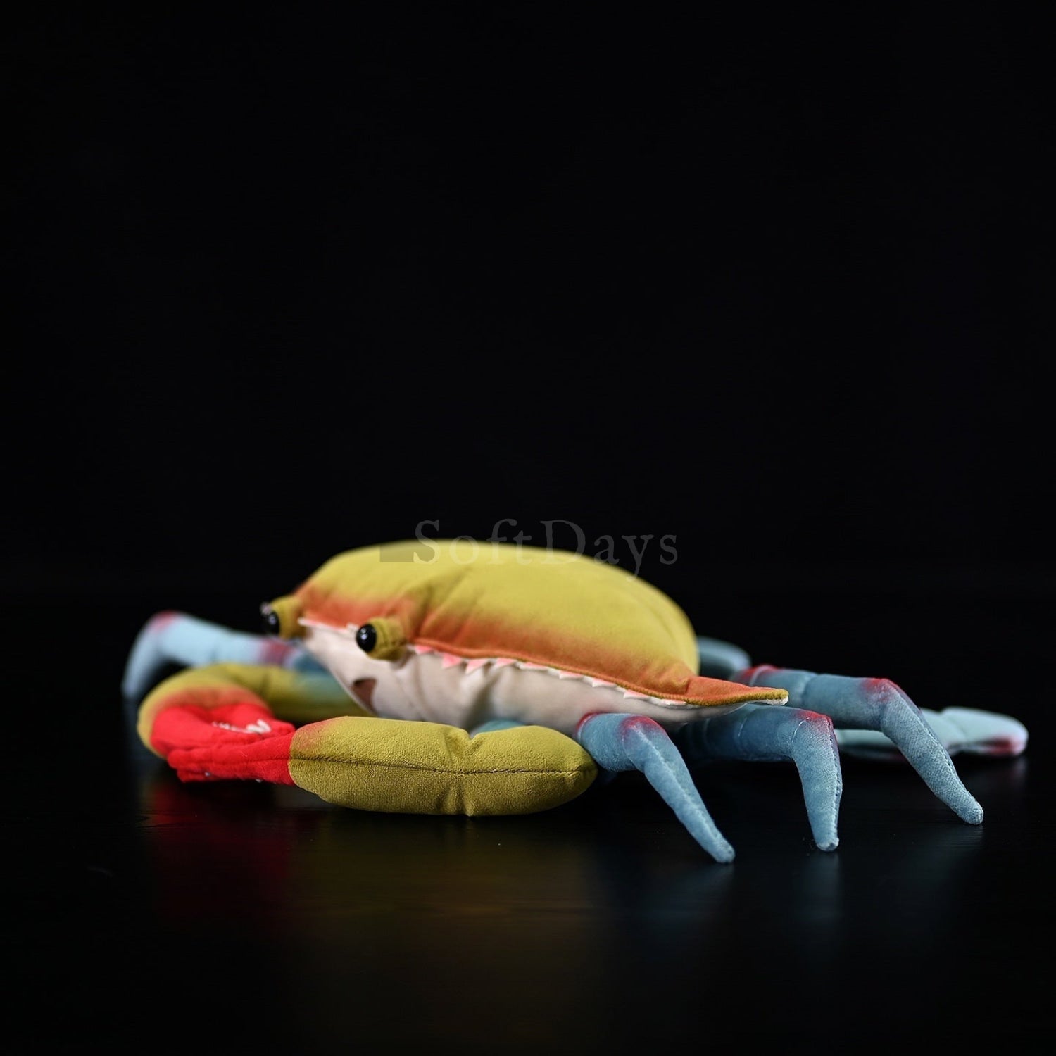 Side view of a lifelike Blue Crab plush toy with vibrant colors, a perfect marine-themed stuffed animal