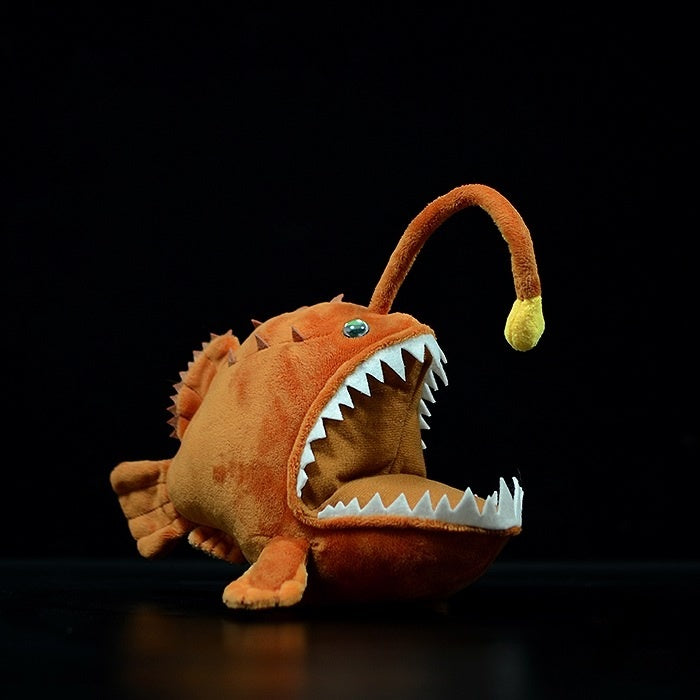 Side view of lifelike Humpback Anglerfish plush toy by SoftDaysLab, showcasing its glowing lure and sharp teeth