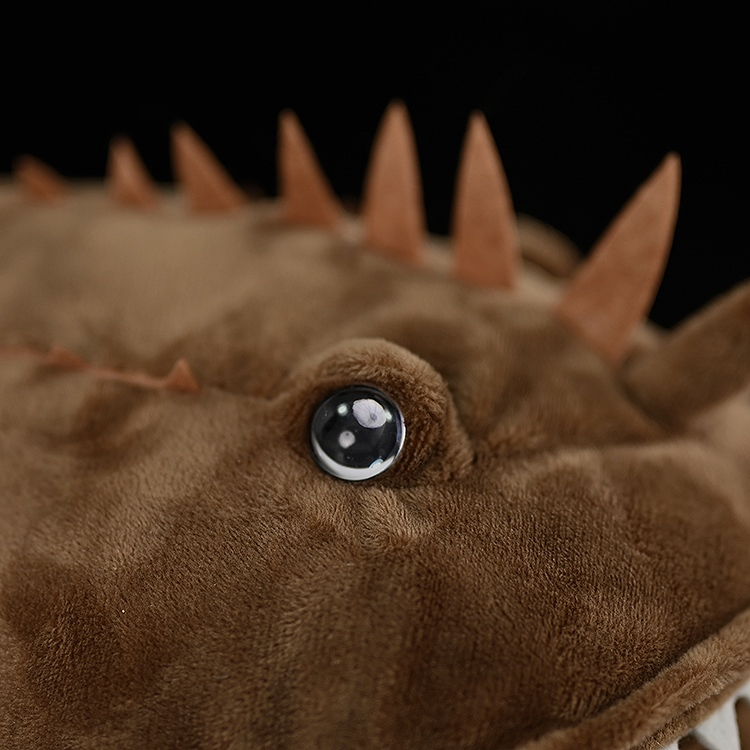 Detailed view of the eye and spines on American Monkfish plush, replicating the unique features of the species