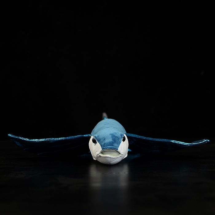 Front view of a lifelike flying fish plush toy showcasing detailed design and wide shimmering fins