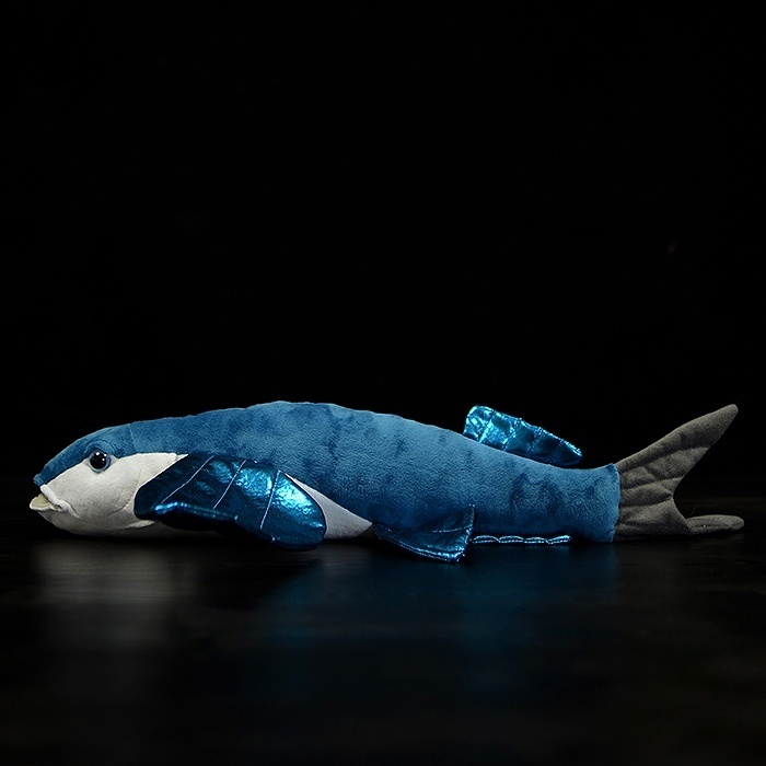 Side profile of a flying fish plush toy with realistic features and sparkling blue wings by SoftDaysLab