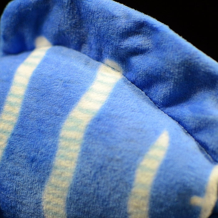 Close-up of the dorsal fin of a blue tang plush toy, highlighting soft fabric and blue details