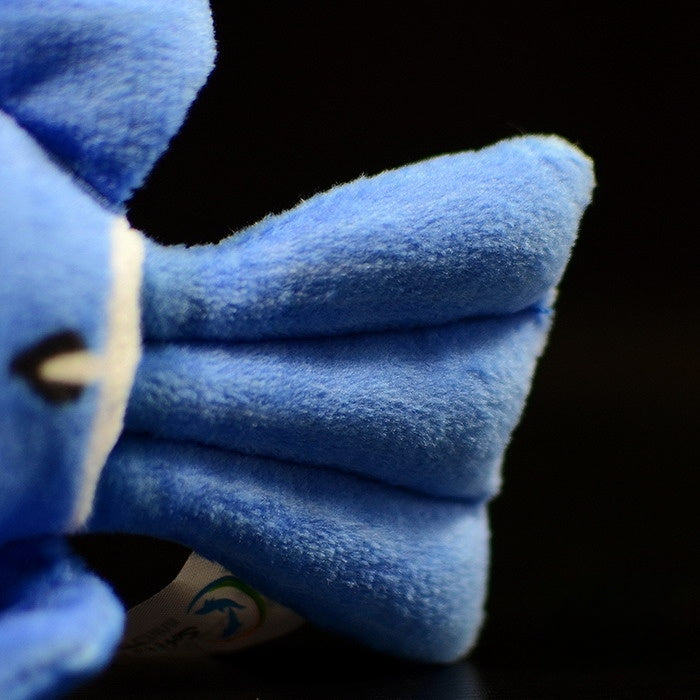 Tail fin detail of a blue tang fish plush toy, crafted with soft and realistic materials