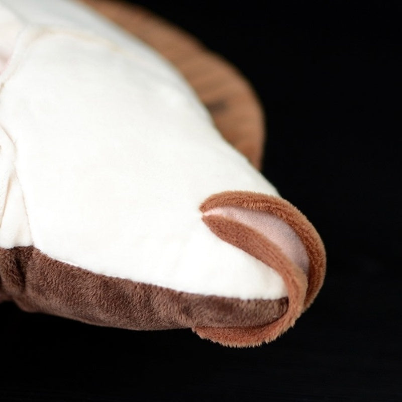 Detailed view of flounder plush underside tail, showcasing its smooth textures and lifelike craftsmanship