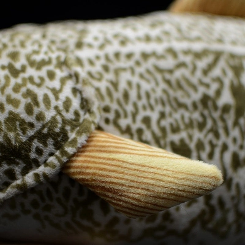 Close-up of the side fin of Atlantic cod plush toy, featuring striped details and soft fabric