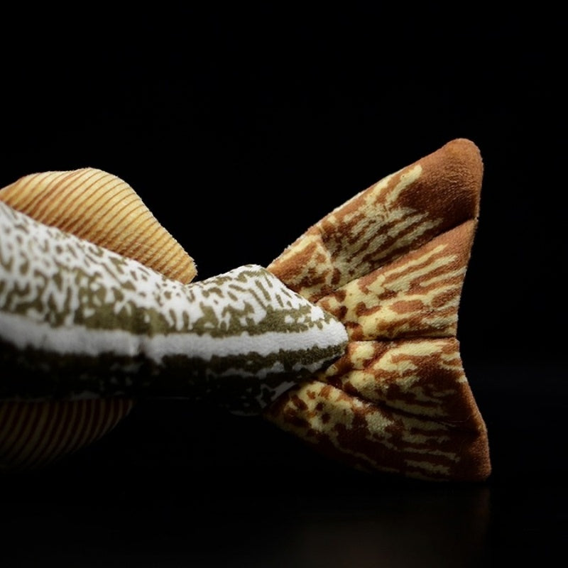 Tail close-up of Atlantic cod plush toy, showing intricate patterns and realistic color shading