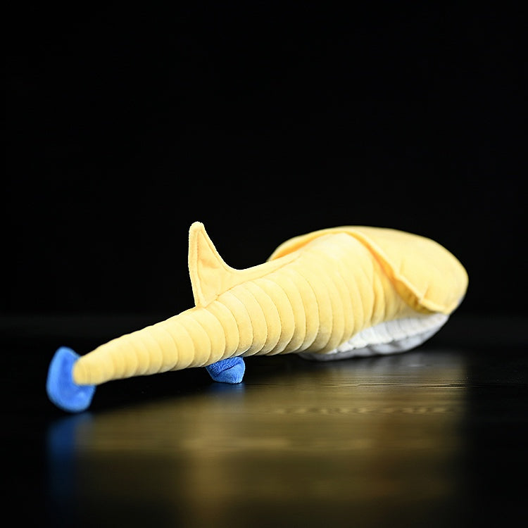 Rear view of Sacabambaspis plush toy highlighting its long tail and fin design by SoftDaysLab