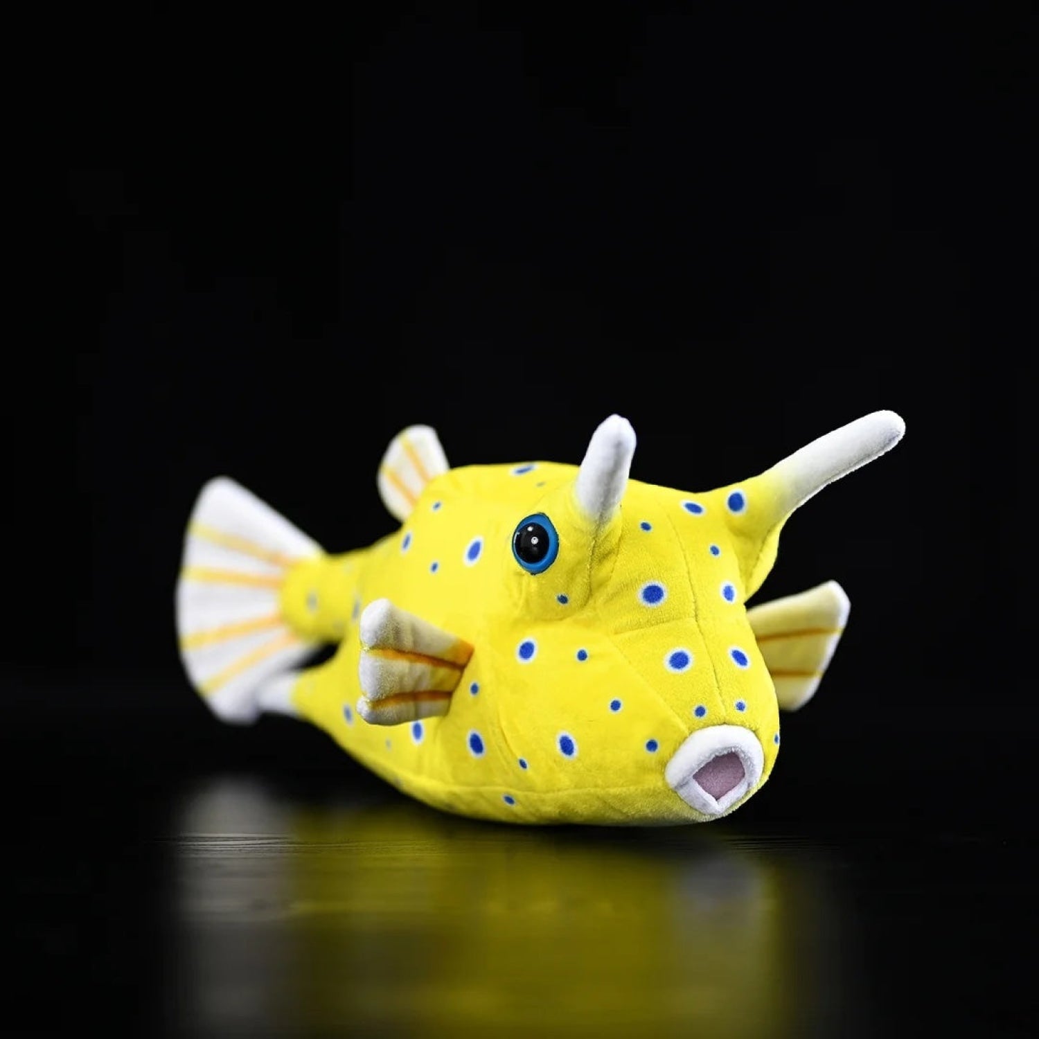 Vibrant yellow Longhorn Cowfish plush toy with blue spots and realistic horns