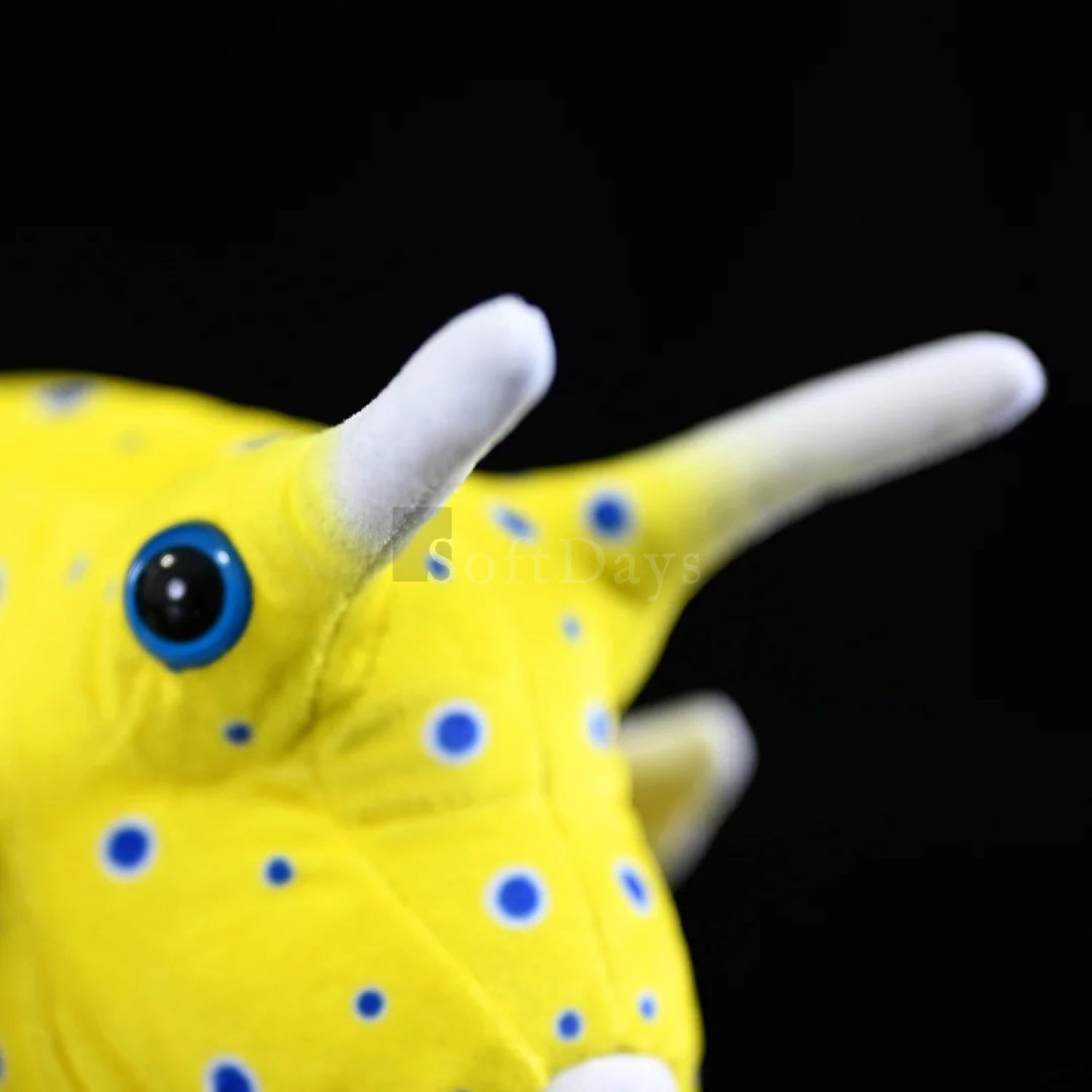 Close-up of Longhorn Cowfish plush toy’s horns and big blue eye for a realistic marine look