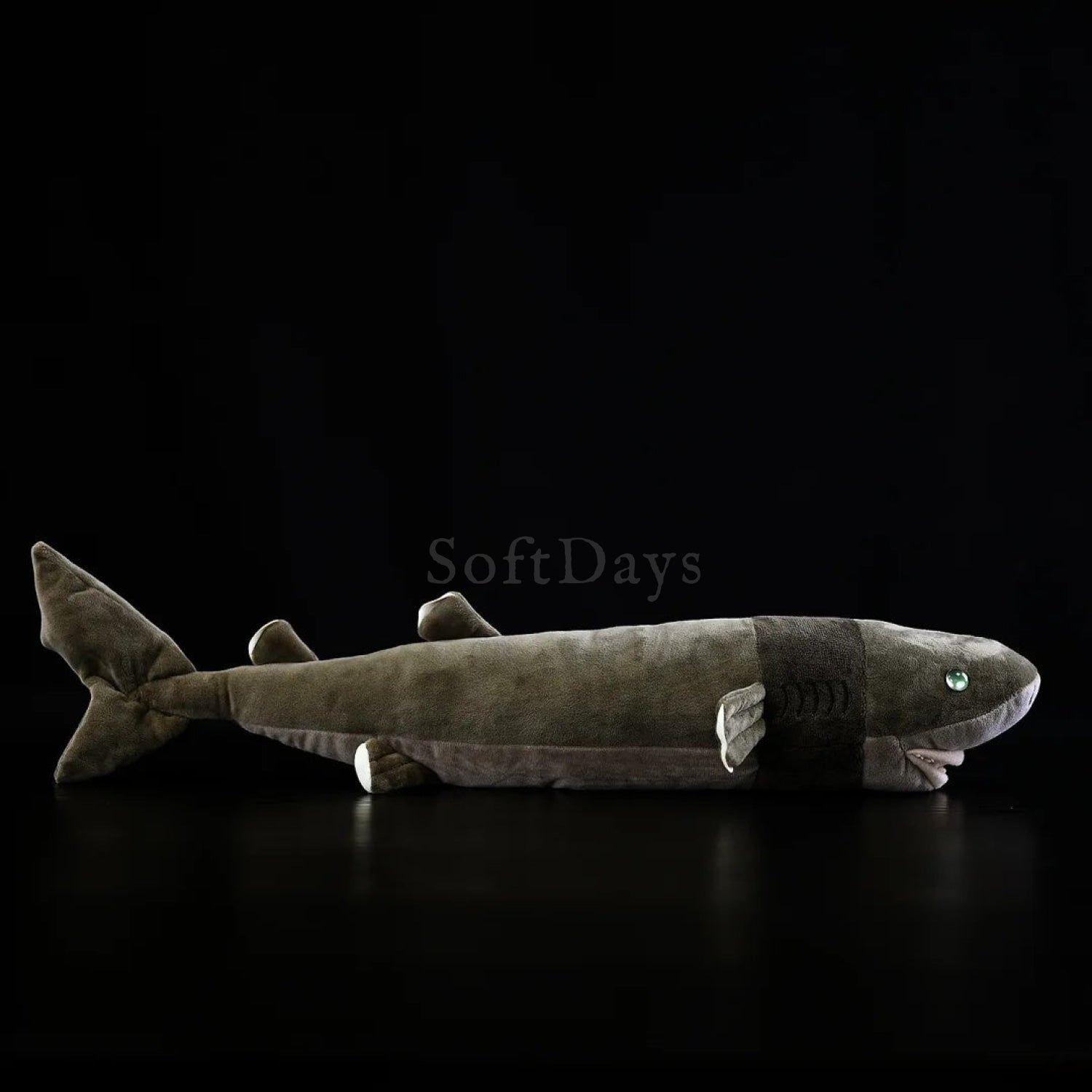 Cookiecutter shark plush toy with realistic design, soft texture, and lifelike shark features
