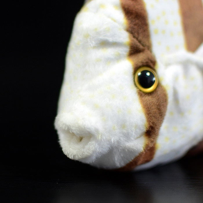 Close-up of the head of a Four-banded Butterflyfish plush, showing its realistic features