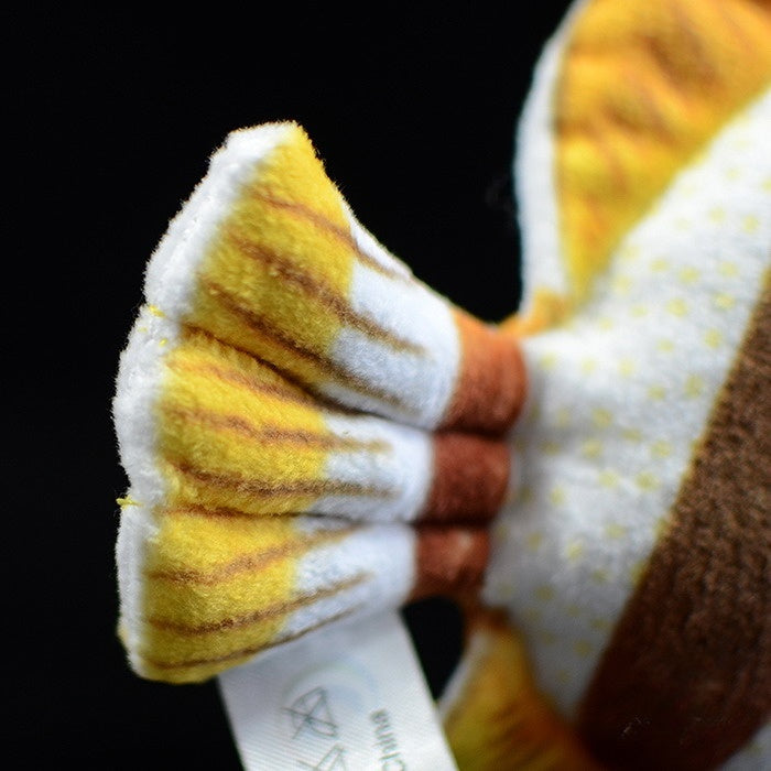 Close-up of the tail of a Four-banded Butterflyfish plush, showcasing its lifelike striped design