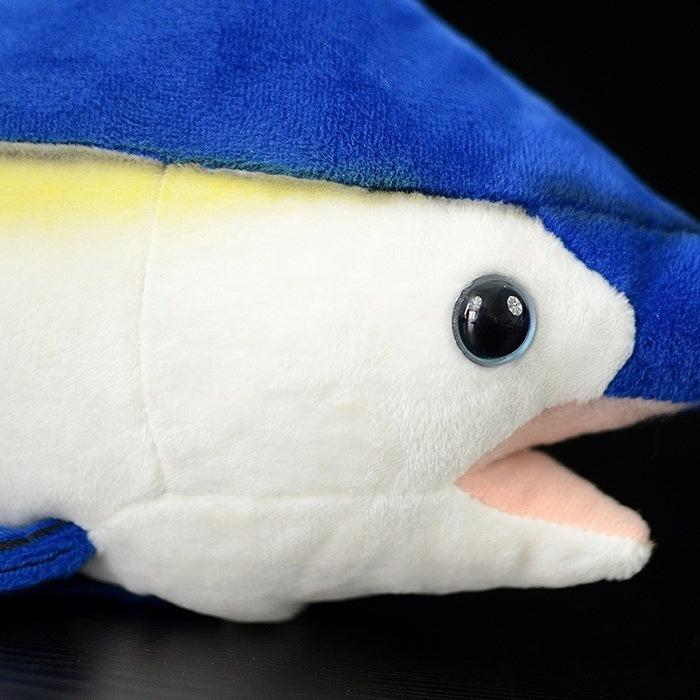 Close-up of the face of an Indo-Pacific Sailfish plush toy with lifelike eyes and soft fabric