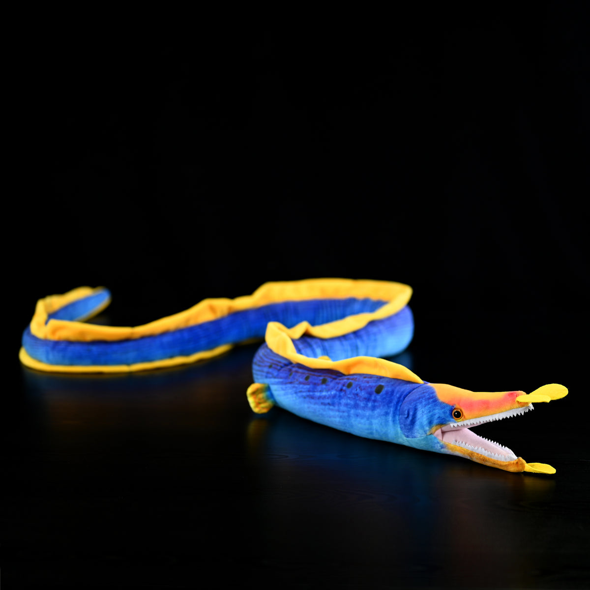 Ribbon Eel Plush Toy by SoftDaysLab® with detailed facial features and intricate tail design in motion