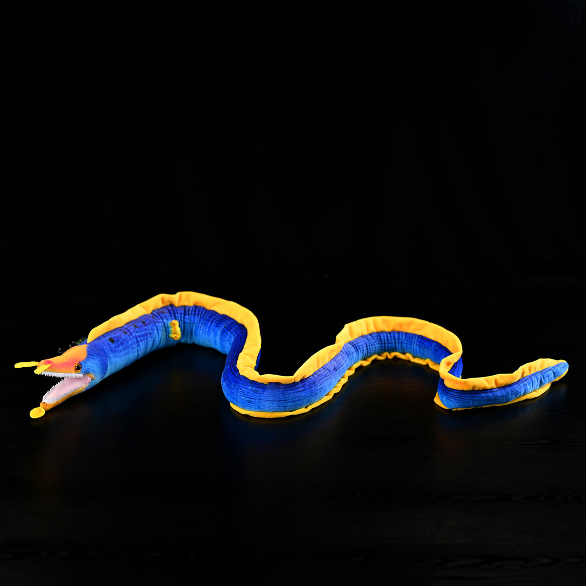 Full-body view of the Ribbon Eel Plush Toy by SoftDaysLab®, arranged in a natural, curved position