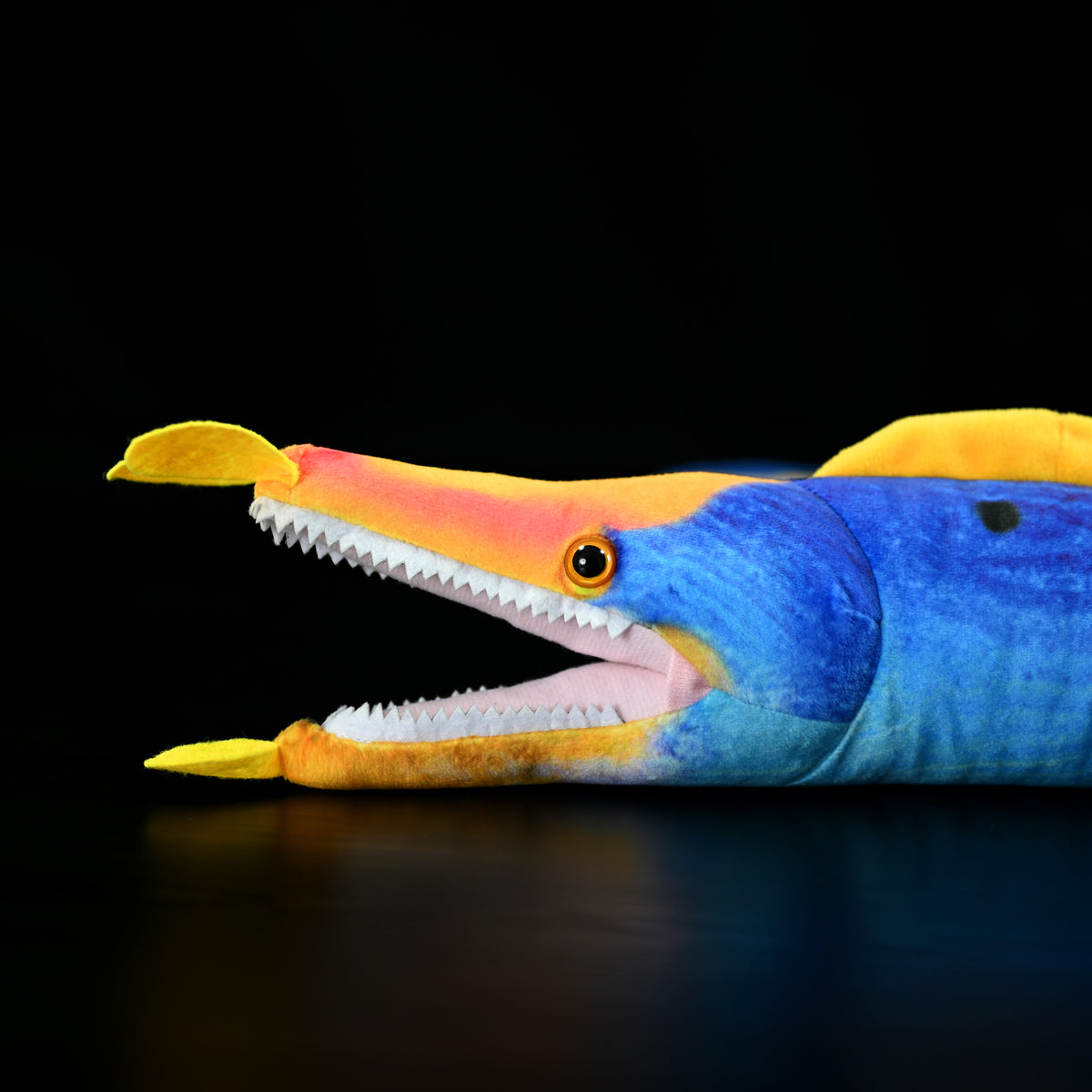 Close-up of the lifelike face and sharp teeth of the Ribbon Eel Plush Toy by SoftDaysLab®