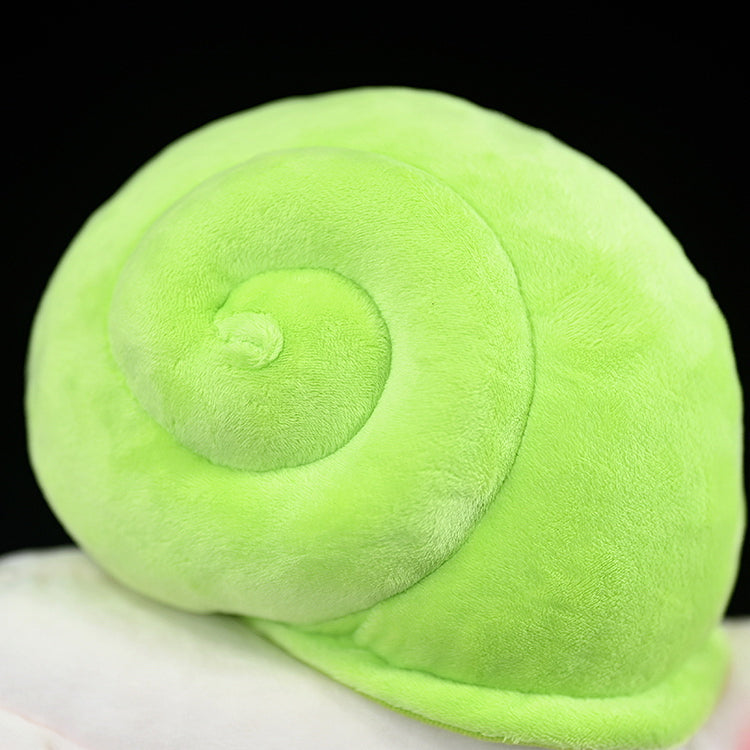 Close-up of the green spiral shell on the realistic Leptopoma nitidum snail plush toy, showcasing soft and lifelike design