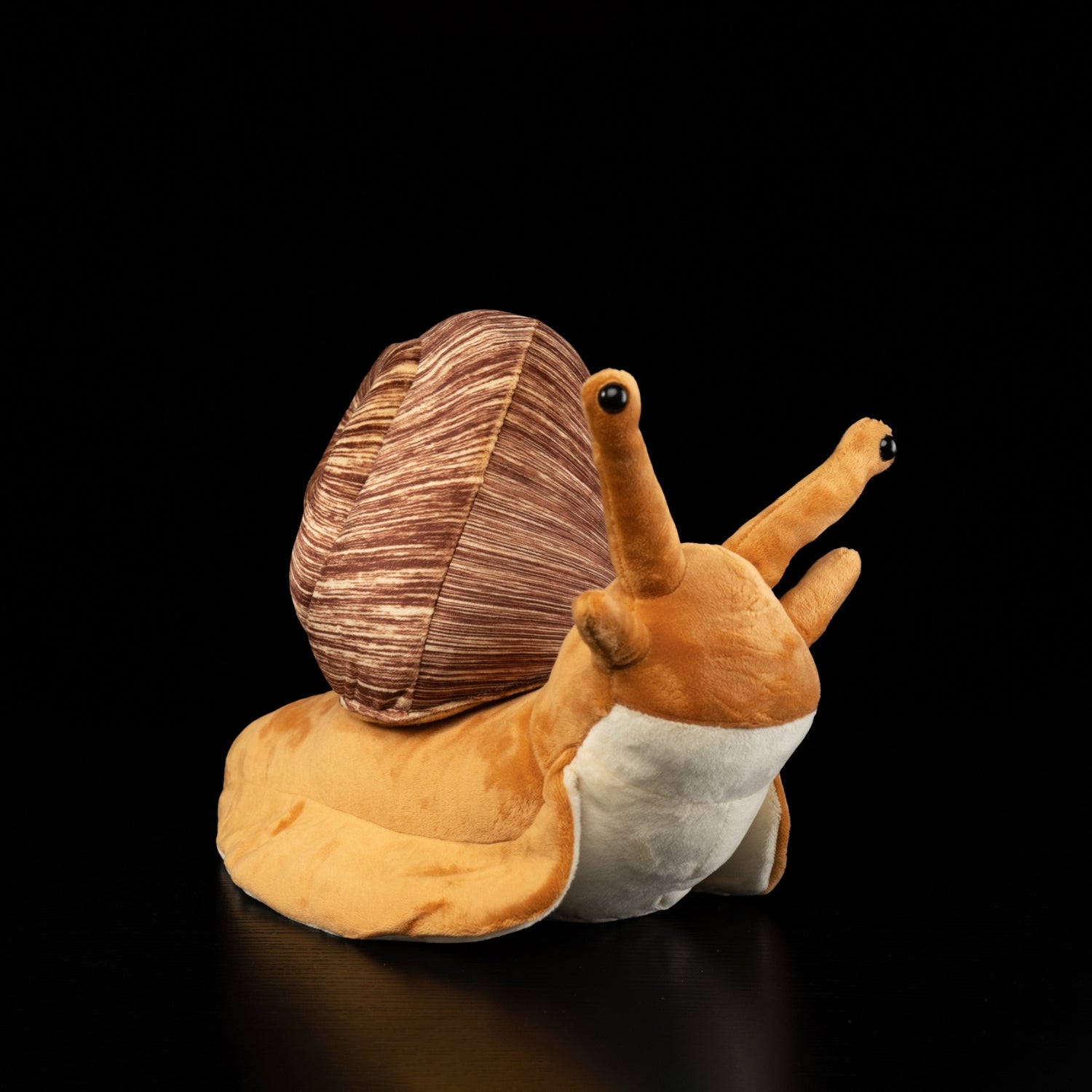 Angled view of snail plush toy showing realistic features and soft craftsmanship by SoftDaysLab