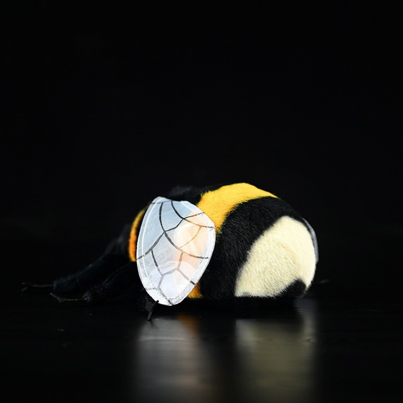 Rear view of a bumblebee plush toy with a fluffy yellow body, black stripes, and realistic wings by SoftDaysLab