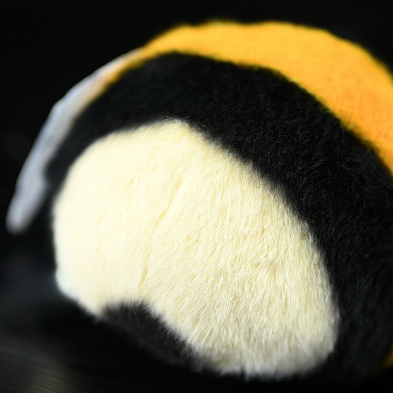 Close-up of the fluffy yellow and black body of a bumblebee plush toy, soft and realistic in design by SoftDaysLab