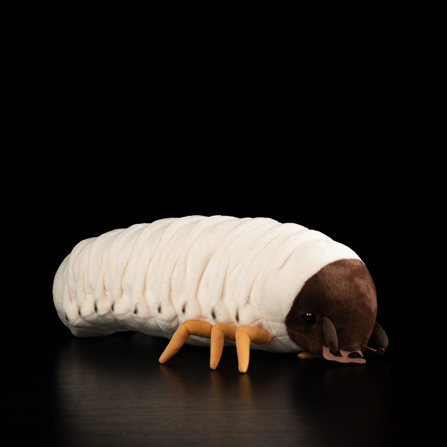 Full view of a realistic white grub plush toy with soft segmented body and lifelike features by SoftDaysLab