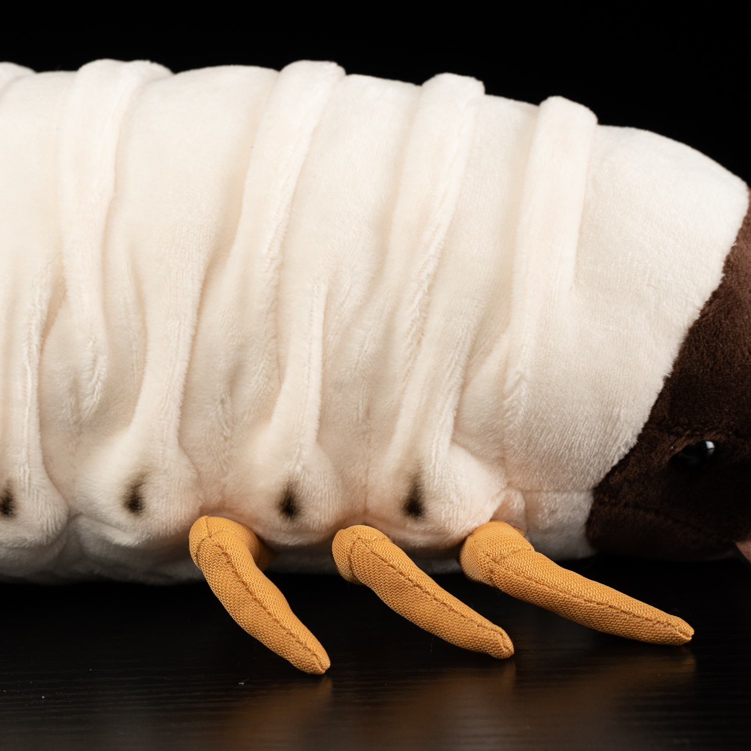 Detailed view of the White Grub Plush Toy’s lifelike orange legs and realistic body folds by SoftDaysLab