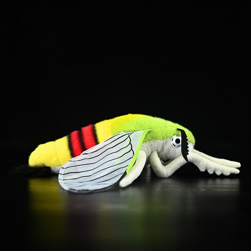 Profile view of a coffee bee hawkmoth plush, showcasing its lifelike legs and colorful design by SoftDaysLab