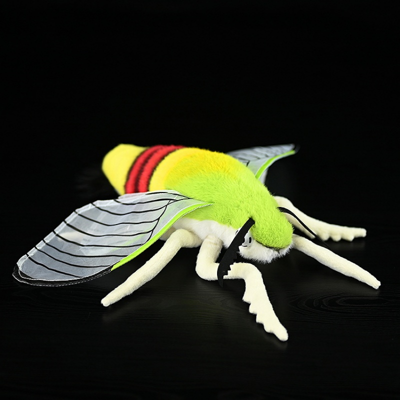 Top view of a coffee bee hawkmoth plush toy with translucent wings and bright yellow-green body by SoftDaysLab