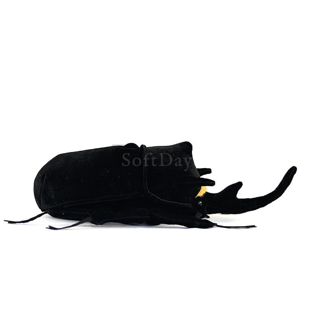 Side view of a realistic Mars rhino beetle plush toy with lifelike horns and black body by SoftDaysLab