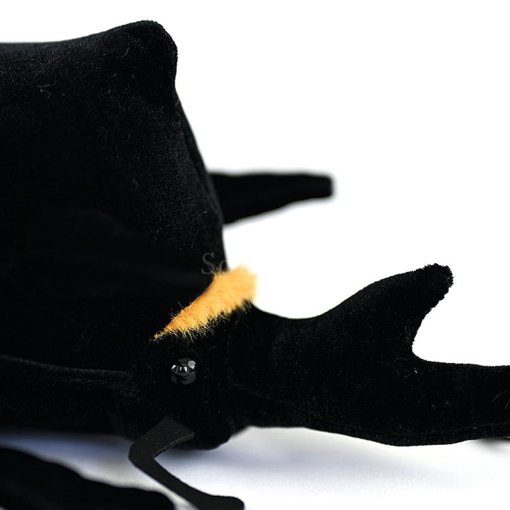 Detailed view of the Mars rhino beetle plush head, showcasing lifelike eyes and textured horn design