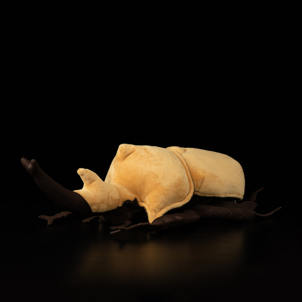 Angled side view of SoftDaysLab® plush elephant beetle in a natural pose, ideal for beetle and nature lovers