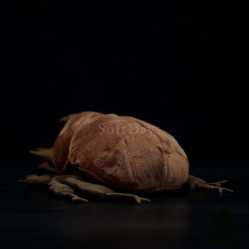 Rear view of a Japanese rhinoceros beetle plush toy, featuring a smooth, detailed body and lifelike craftsmanship