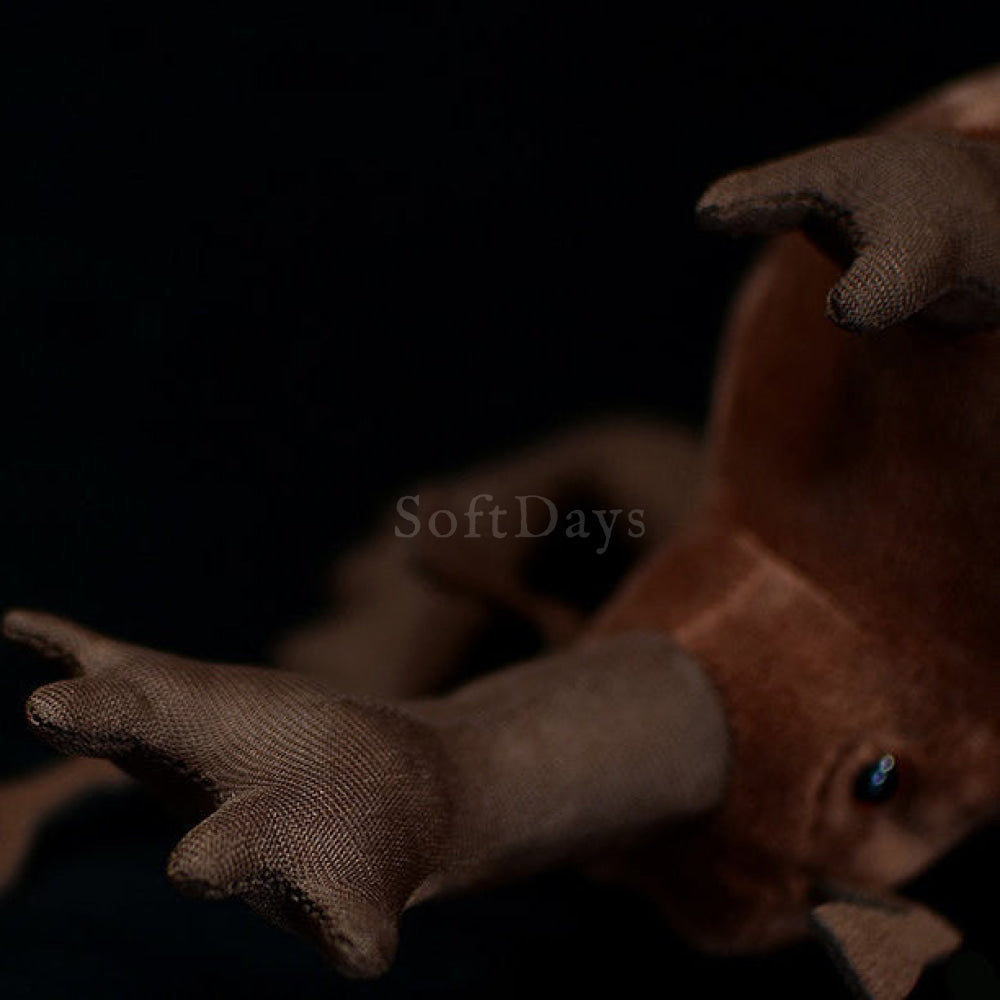 Close-up of the Japanese rhinoceros beetle plush toy's horns, showcasing its realistic design and soft fabric