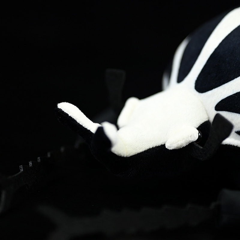 Close-up of the Goliath beetle plush toy's head and mandibles, showcasing lifelike features by SoftDaysLab