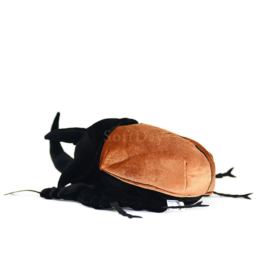 Rear view of the plush five-horned rhinoceros beetle, showcasing its soft golden elytra by SoftDaysLab