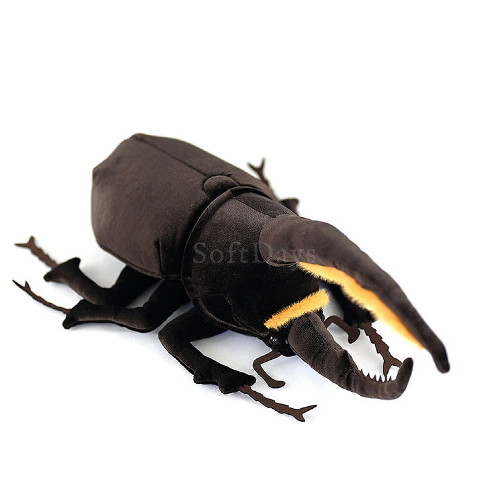 Top-down view of Neptune Hercules beetle plush showing its lifelike black body and prominent horns