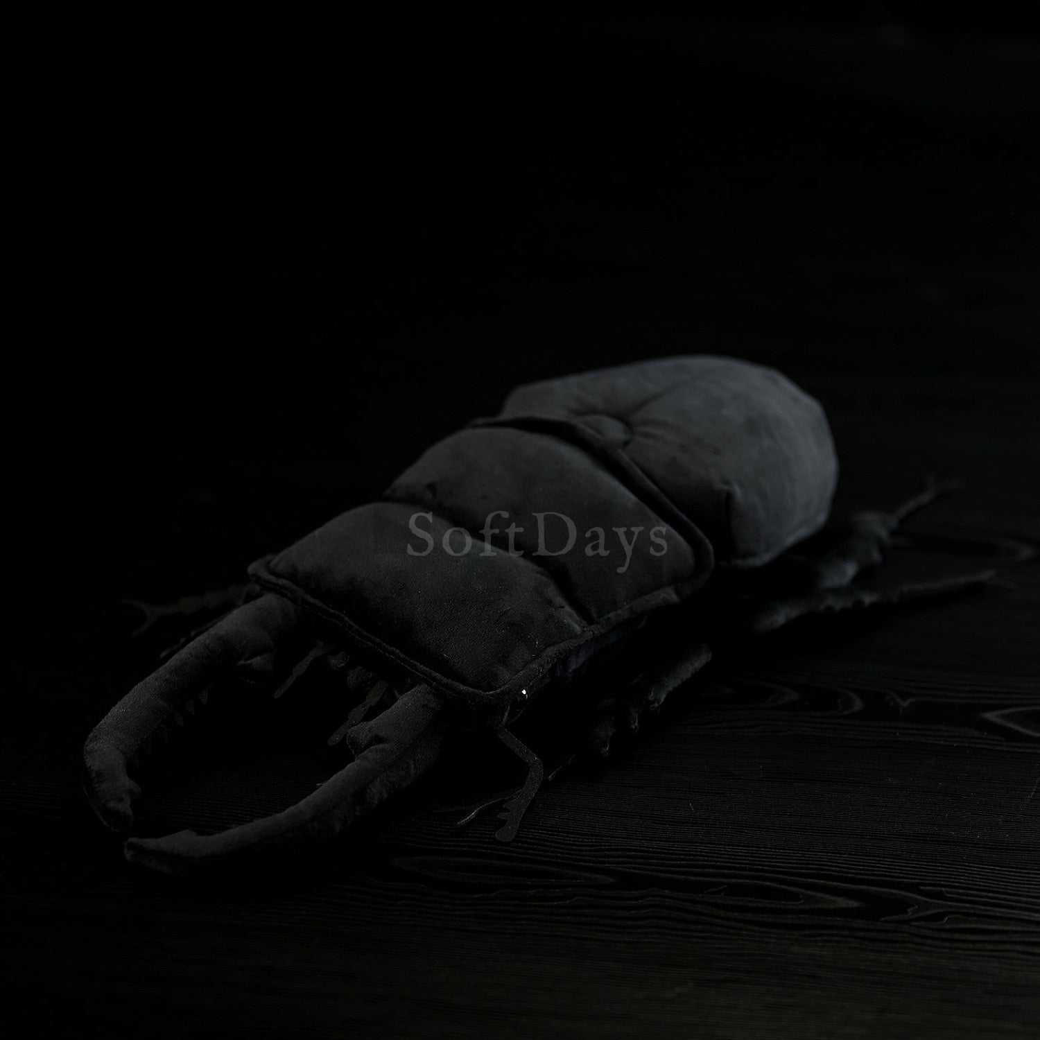 Top-down view of Dorcus Hopei Stag Beetle plush featuring its black velvety texture and lifelike accuracy